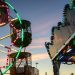 Valencia, Spain - December 14, 2018: Children's ferris wheel decorated with many lights and drawings at dusk at a Christmas fair.